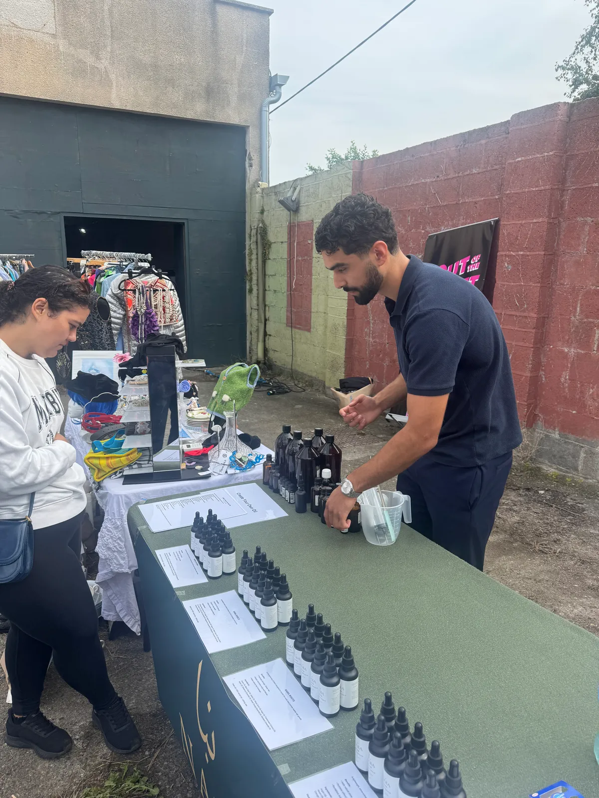 Eamonn sharing Naba oils at an early market stall